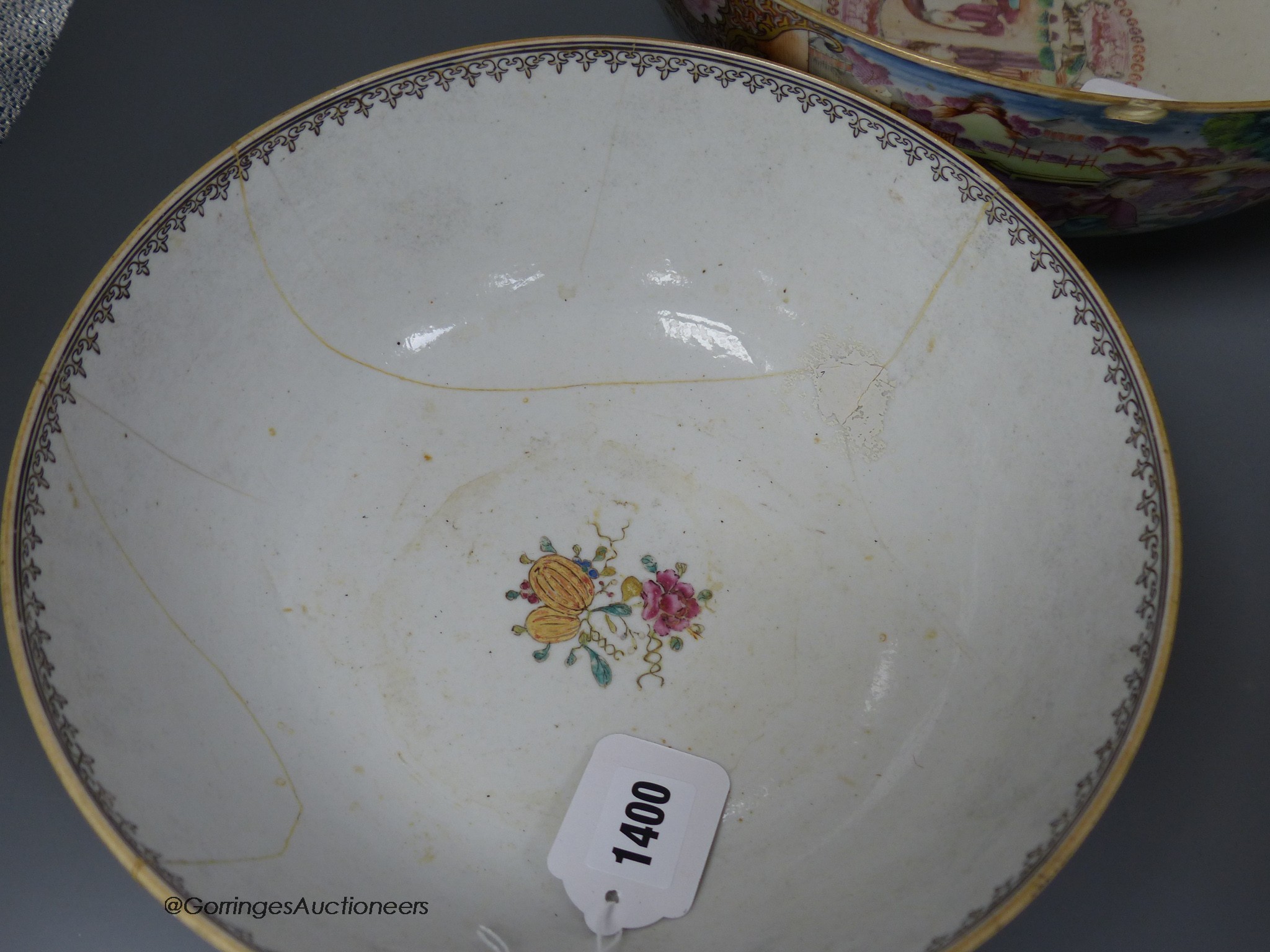 An 18th century Chinese Export famille rose punch bowl and another similar bowl (a.f.), largest 32cm diameter